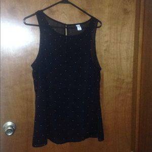 Sheer sleeveless top with black camisole under